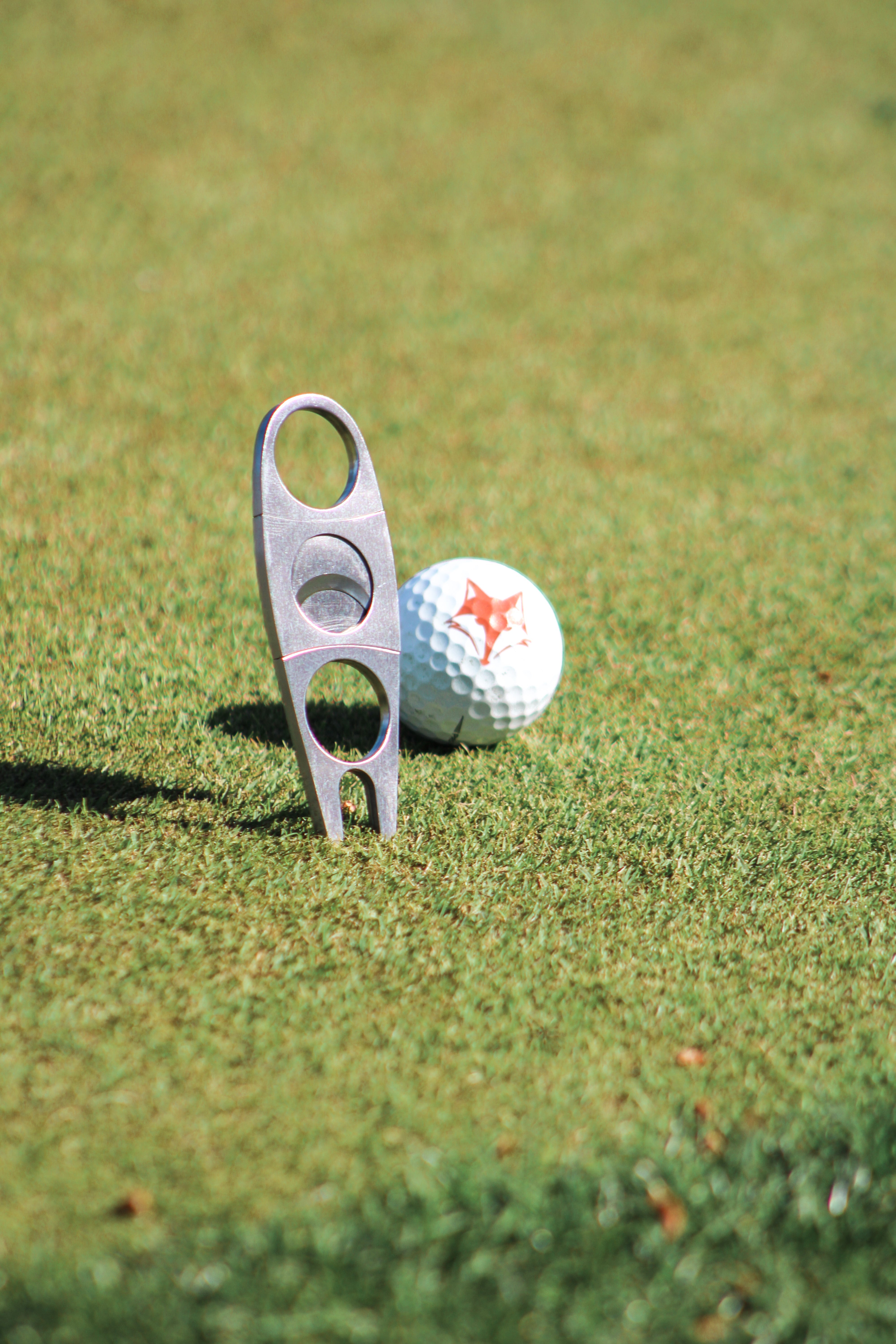 Cigar Cutter + Divot Repair Tool